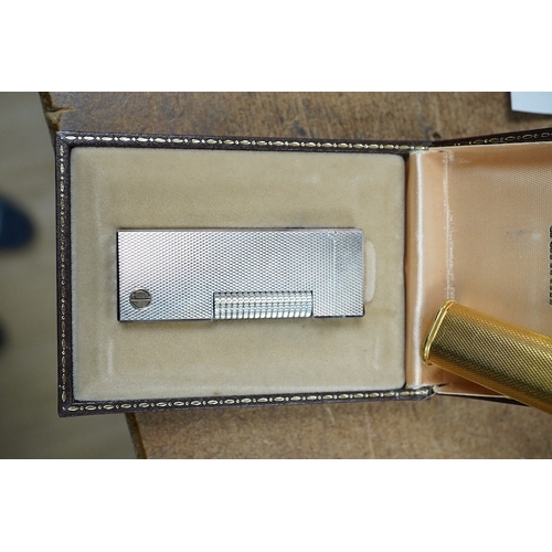 1450 - Two Dunhill Rollalite lighters, gold plated and silver, gold plated 7 cm high, Condition - fair to g... 