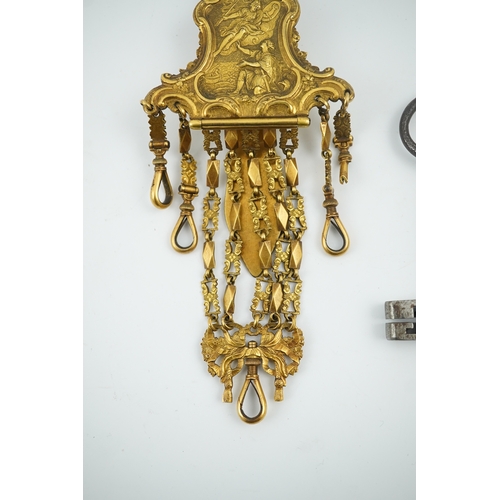 1459 - A late 18th century German gilt metal chatelaine and a steel key, chaterlaine 14cm long. Condition -... 