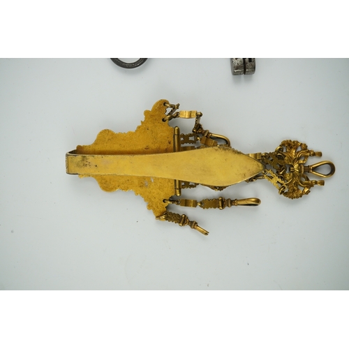 1459 - A late 18th century German gilt metal chatelaine and a steel key, chaterlaine 14cm long. Condition -... 