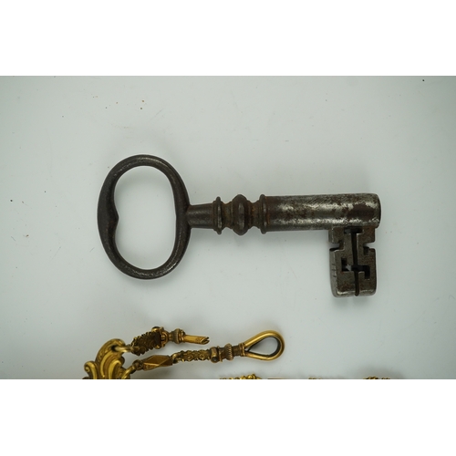 1459 - A late 18th century German gilt metal chatelaine and a steel key, chaterlaine 14cm long. Condition -... 