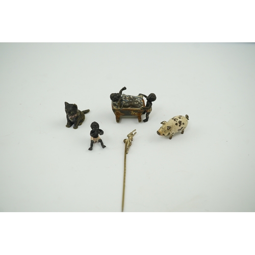 1467 - Four novelty miniature cold painted bronzes; black boy with cradle, black baby, cat and pig and a si... 