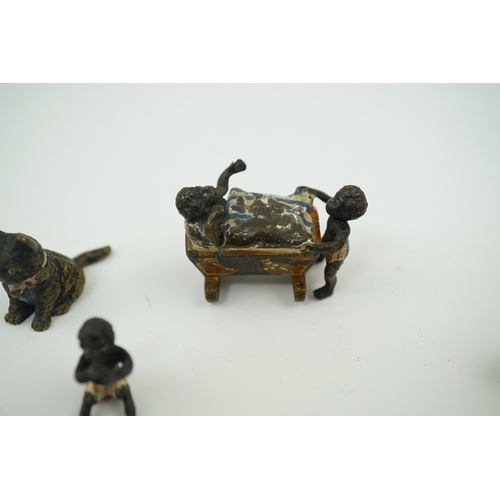 1467 - Four novelty miniature cold painted bronzes; black boy with cradle, black baby, cat and pig and a si... 