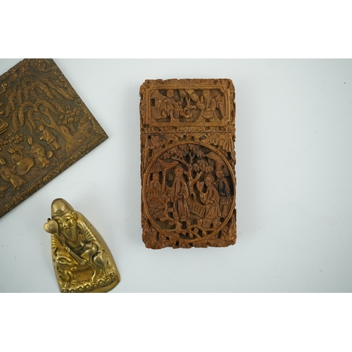 1470 - A Chinese carved sandalwood card case, a bronze relief cast and chased plaque and a gilt metal Shou ... 