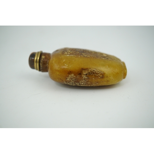 1472 - A Chinese soapstone snuff bottle with tiger's eye stopper, 8cm high. Condition - fair