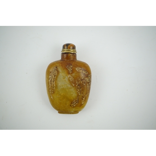 1472 - A Chinese soapstone snuff bottle with tiger's eye stopper, 8cm high. Condition - fair