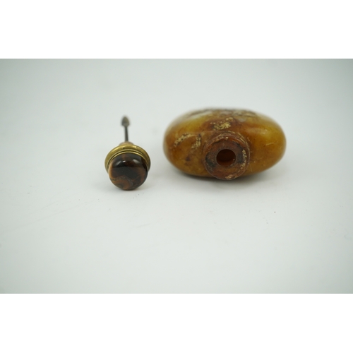 1472 - A Chinese soapstone snuff bottle with tiger's eye stopper, 8cm high. Condition - fair