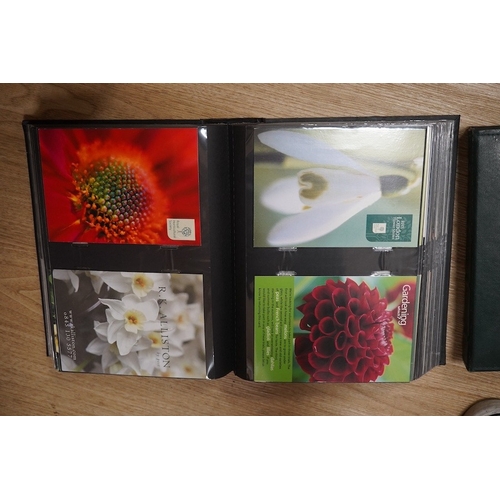 1484 - A quantity of various post cards arranged in three albums to include botanical interest. Condition -... 