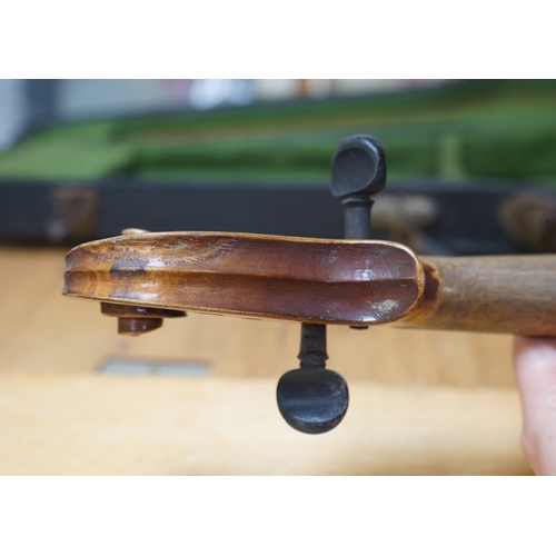 1492 - Early 20th century ¾ size violin, unlabelled, cased, together with a violin table, back and scroll. ... 