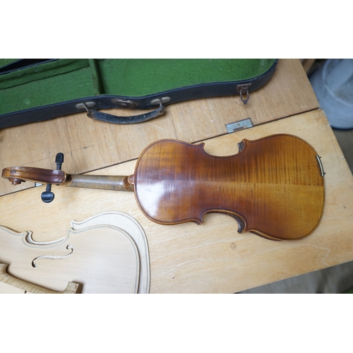 1492 - Early 20th century ¾ size violin, unlabelled, cased, together with a violin table, back and scroll. ... 