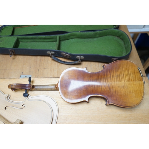 1492 - Early 20th century ¾ size violin, unlabelled, cased, together with a violin table, back and scroll. ... 