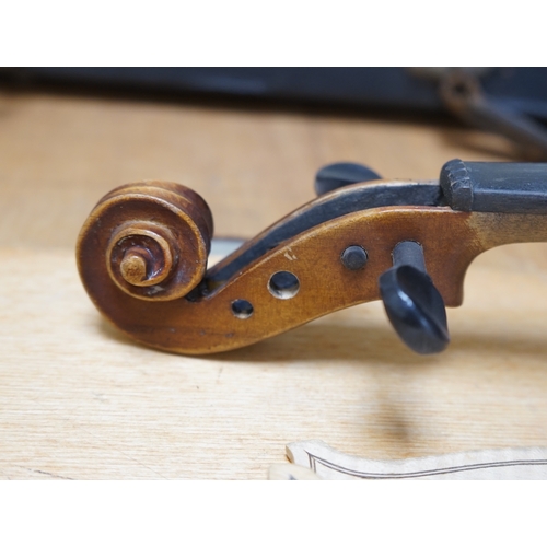 1492 - Early 20th century ¾ size violin, unlabelled, cased, together with a violin table, back and scroll. ... 