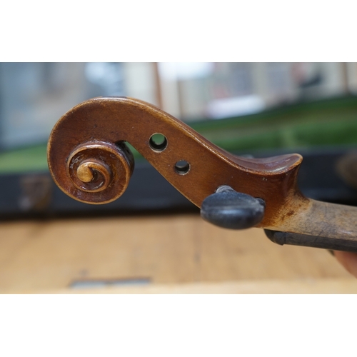 1492 - Early 20th century ¾ size violin, unlabelled, cased, together with a violin table, back and scroll. ... 