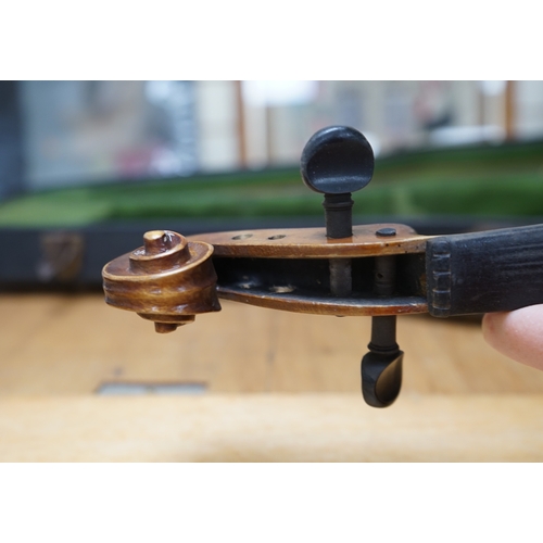 1492 - Early 20th century ¾ size violin, unlabelled, cased, together with a violin table, back and scroll. ... 