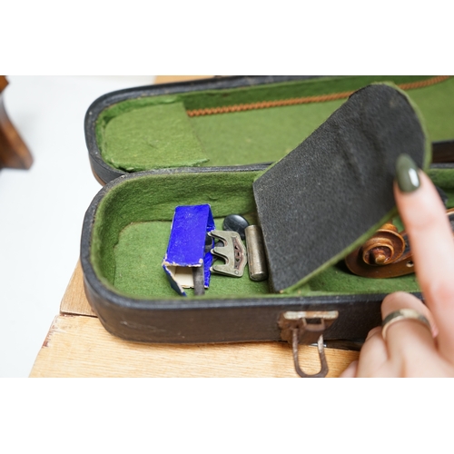 1492 - Early 20th century ¾ size violin, unlabelled, cased, together with a violin table, back and scroll. ... 