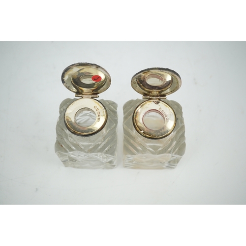 1842 - A pair of silver mounted cut glass inkwells, maker JT, height 66mm. Condition - fair to good