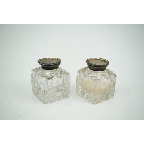 1842 - A pair of silver mounted cut glass inkwells, maker JT, height 66mm. Condition - fair to good