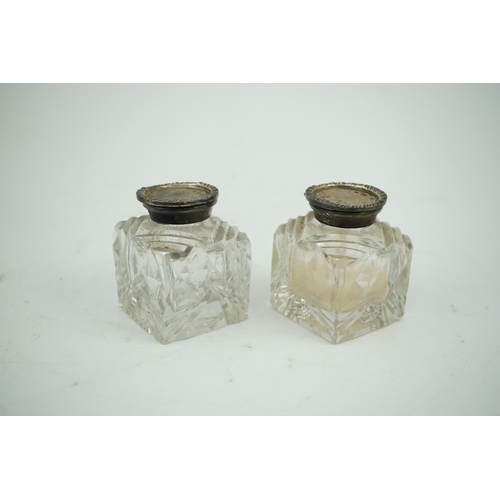 1842 - A pair of silver mounted cut glass inkwells, maker JT, height 66mm. Condition - fair to good