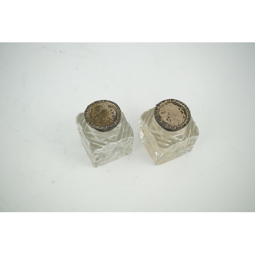 1842 - A pair of silver mounted cut glass inkwells, maker JT, height 66mm. Condition - fair to good