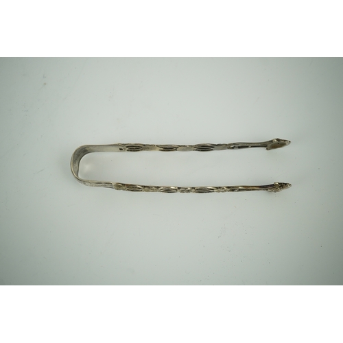 1850 - A pair of George III pierced silver tongs, makers mark only WC (repair), 13.1cm. Condition - poor... 