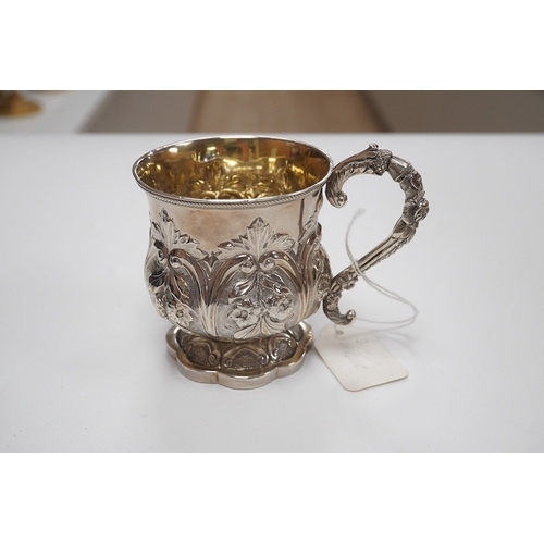 1858 - A cased William IV embossed silver pedestal christening mug, with engraved monogram, by Pearce & Bur... 