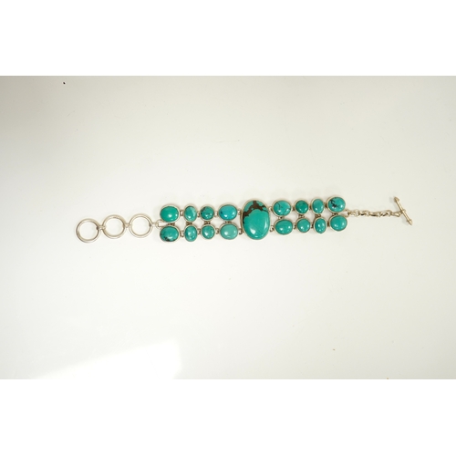 1913 - A modern silver and two row turquoise cluster set bracelet, overall 22cm. Condition - good