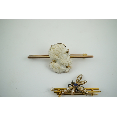 1918 - An Edwardian 15ct mounted cameo shell bar brooch, 49mm, together with a yellow metal, sapphire and s... 