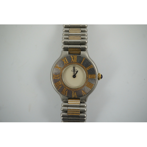 102 - A lady's steel and gold plated Must De Cartier quartz wrist watch, on a steel and gold plated Must D... 