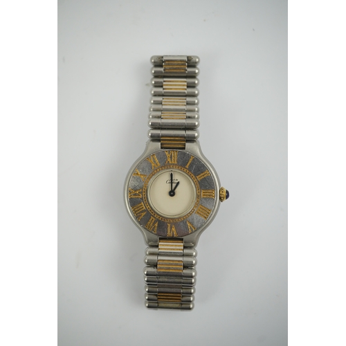 102 - A lady's steel and gold plated Must De Cartier quartz wrist watch, on a steel and gold plated Must D... 