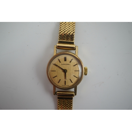 105 - A lady's modern gold Longines manual wind wrist watch, on an Italian 18k gold bracelet, overall 16.5... 