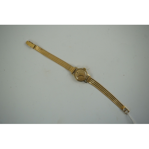 105 - A lady's modern gold Longines manual wind wrist watch, on an Italian 18k gold bracelet, overall 16.5... 