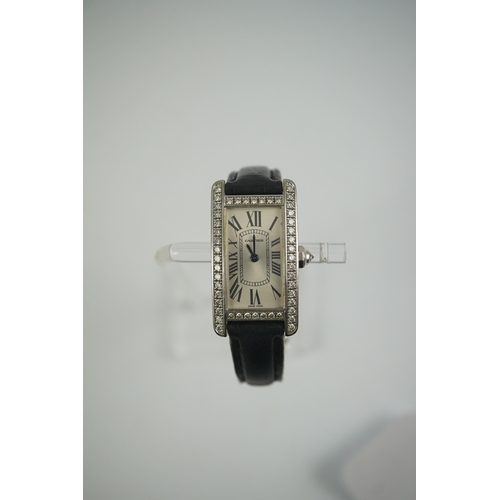 109 - A lady's modern 18ct white gold and diamond set Cartier Tank Americaine quartz wrist watch, with cur... 