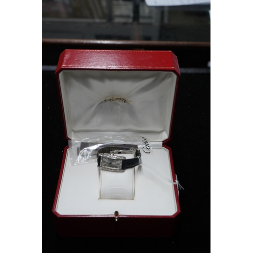 109 - A lady's modern 18ct white gold and diamond set Cartier Tank Americaine quartz wrist watch, with cur... 