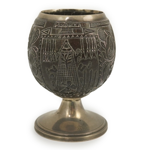 11 - A George III silver mounted 'Masonic' coconut cup, maker GW, carved throughout with Masonic emblems,... 