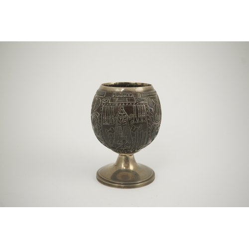 11 - A George III silver mounted 'Masonic' coconut cup, maker GW, carved throughout with Masonic emblems,... 