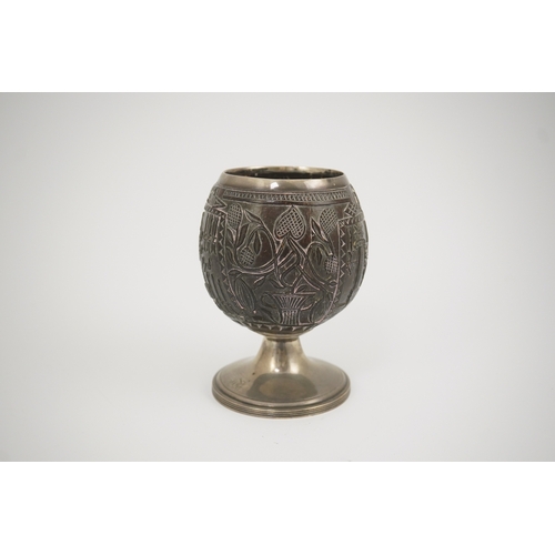 11 - A George III silver mounted 'Masonic' coconut cup, maker GW, carved throughout with Masonic emblems,... 