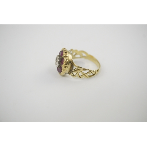 111 - A Georgian gold, ruby and diamond circular cluster ring, set with a central old round cut diamond, b... 