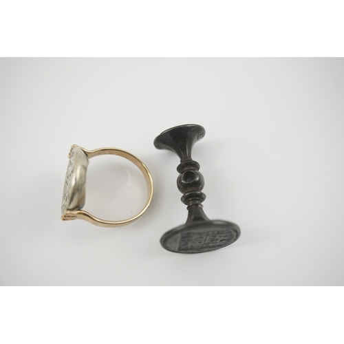 114 - An early 18th century silver and gold signet ring, embossed with an armorial, size R, together with ... 