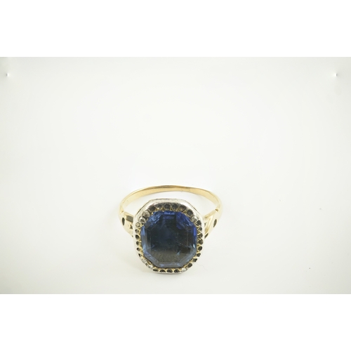 116 - A Georgian gold and single stone collet set octagonal cut sapphire set ring, with a rose cut diamond... 