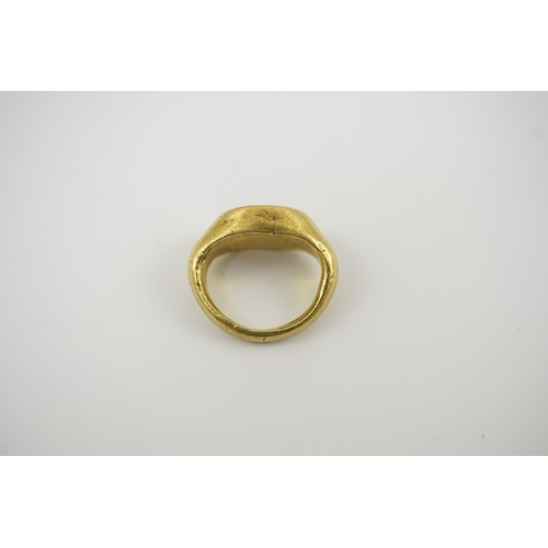 117 - A Roman gold and intaglio set ring, carved with a seated figure, shank misshapen, gross weight 9.5 g... 