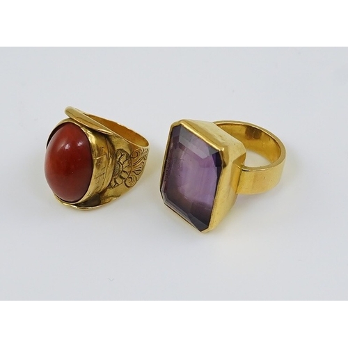 120 - Two antique continental gold rings, one set with emerald cut amethyst measuring approximately 21.2cm... 