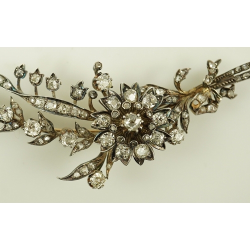 127 - A Victorian gold, silver and diamond cluster foliate spray brooch, set with old mine and rose cut di... 