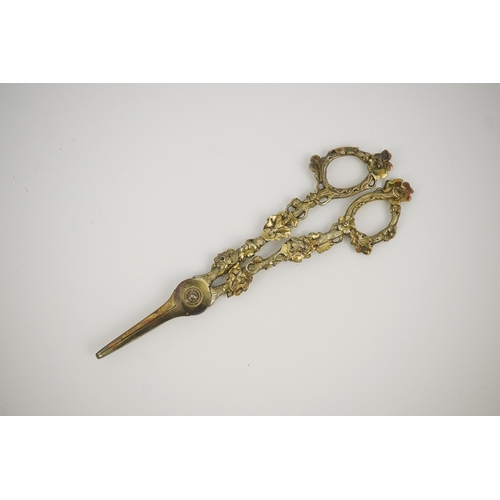 13 - A cased pair of William IV Paul Storr silver gilt grape shears, in later case, with foliate handles,... 