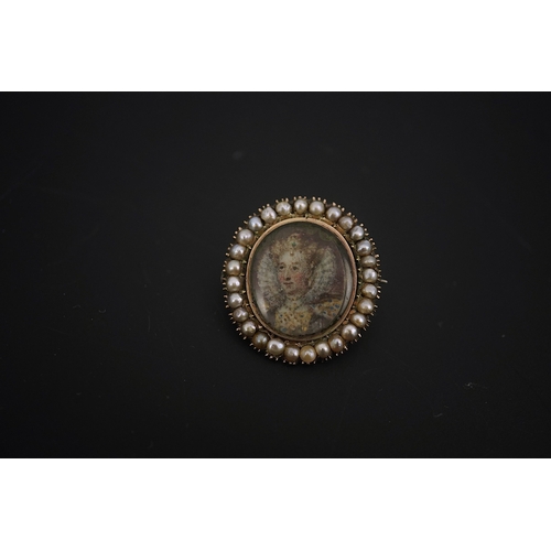 131 - An early 19th century yellow metal and split pearl mounted oval miniature portrait pendant brooch, d... 