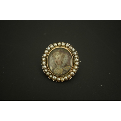 131 - An early 19th century yellow metal and split pearl mounted oval miniature portrait pendant brooch, d... 