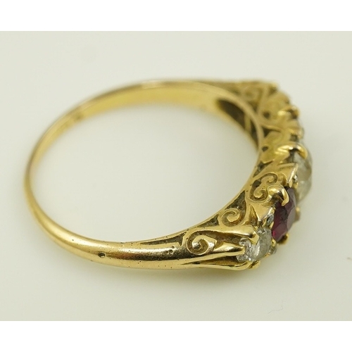 139 - A late Victorian 18ct gold, two stone ruby and three stone diamond set half hoop ring, with carved s... 