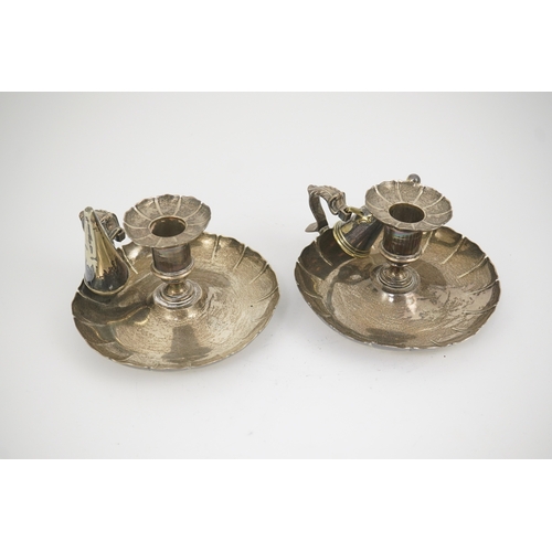 14 - A pair of George IV silver chambersticks, by Richard Sibley I, of circular form with cut borders and... 