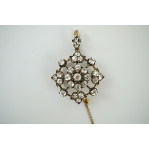 144 - A late Victorian gold, silver and diamond cluster circular pendant brooch, set with old round cut st... 