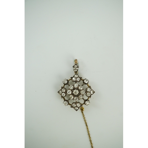 144 - A late Victorian gold, silver and diamond cluster circular pendant brooch, set with old round cut st... 