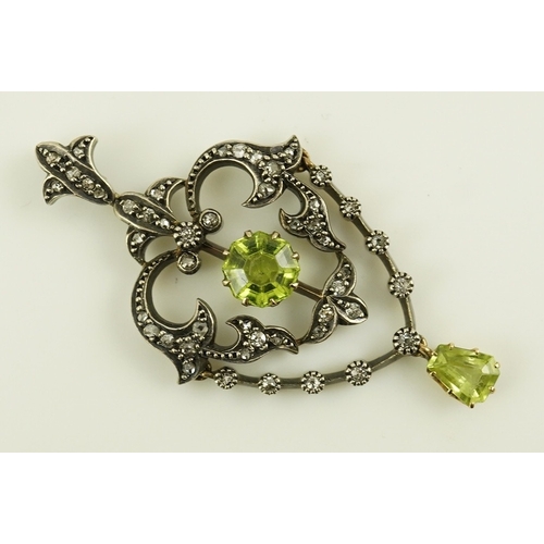 146 - A Victorian gold and silver, peridot and diamond cluster set articulated drop pendant, with octagona... 