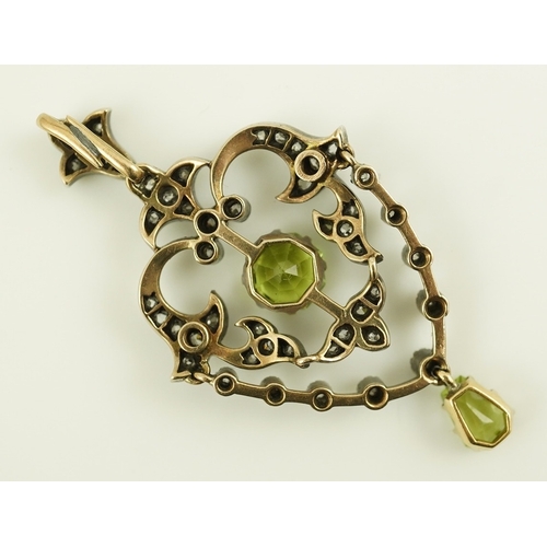 146 - A Victorian gold and silver, peridot and diamond cluster set articulated drop pendant, with octagona... 